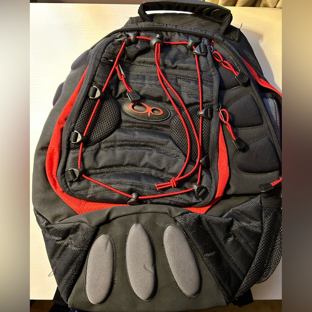 NWOT red and black padded backpack